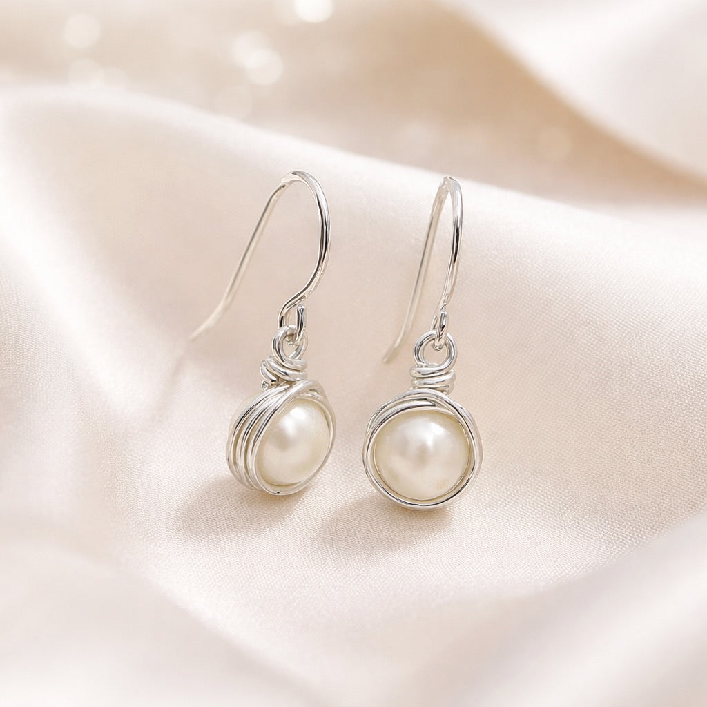 Zilveren oorbellen met zoetwaterparel