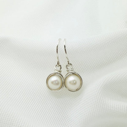 Zilveren oorbellen met zoetwaterparel