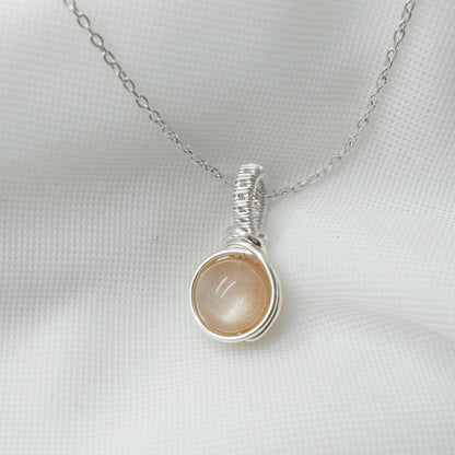 Sterling zilveren hanger met perzik maansteen, handgemaakt wire wrap sieraad