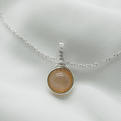 Sterling zilveren hanger met perzik maansteen, handgemaakt wire wrap sieraad