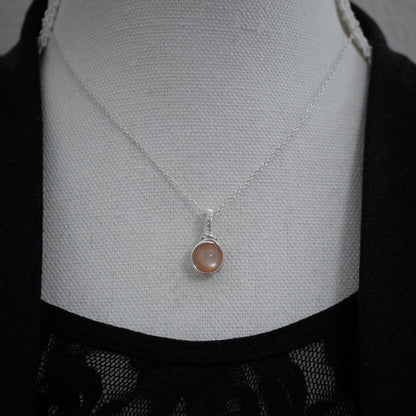 Sterling zilveren hanger met perzik maansteen, handgemaakt wire wrap sieraad